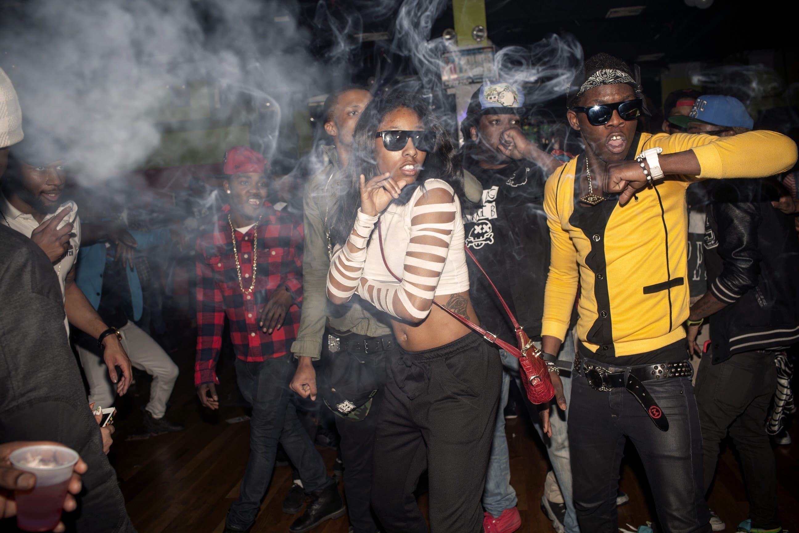 22nd March, 2013. East Flatbush, Brooklyn. The Flavor Essence dance team moves through its choreography in unison as smoke clouds the air in a nightclub around 3am on a Thursday night. 