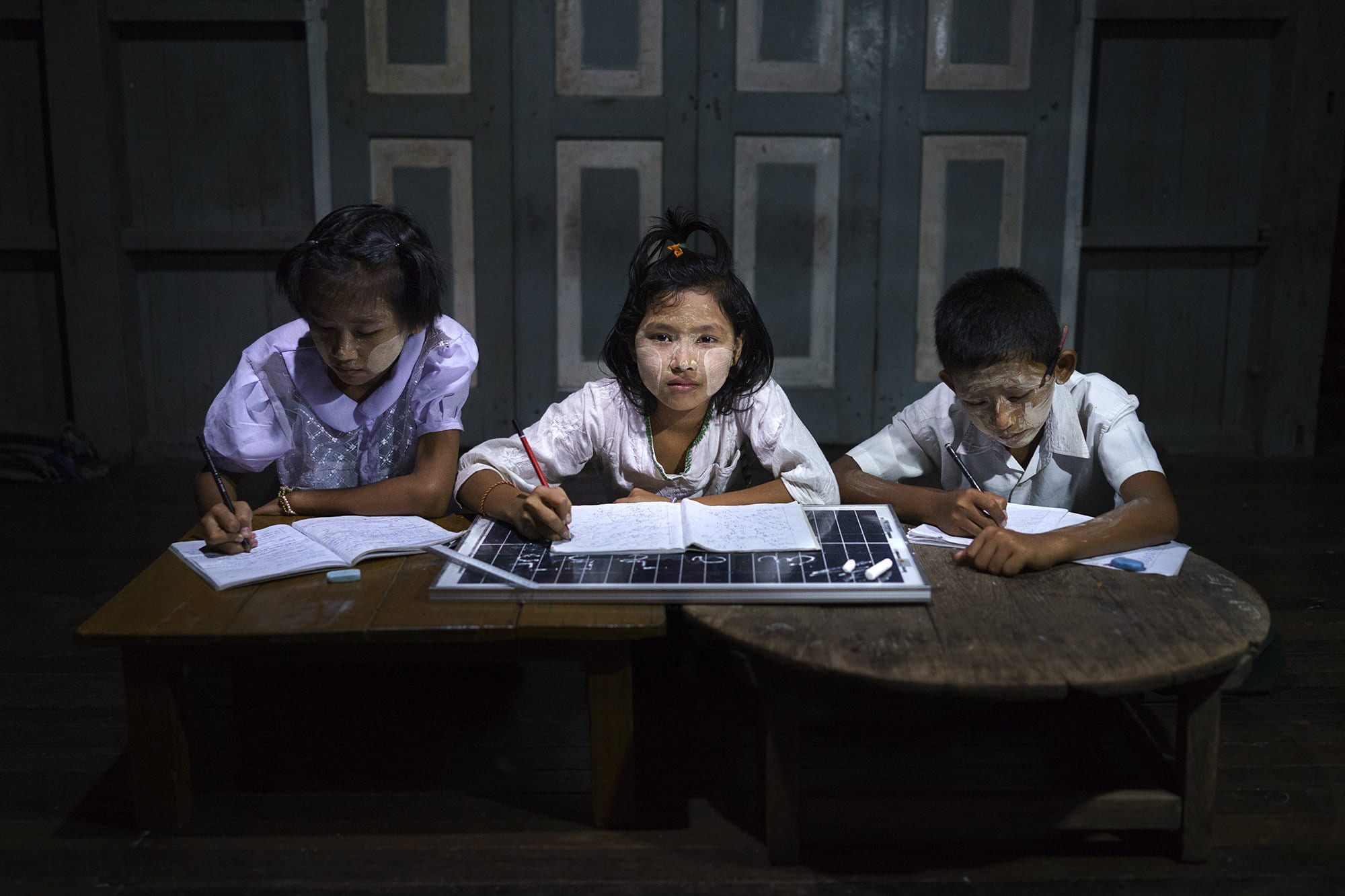 Grade 11 students do their homework in a solar-powered after-school community centre.