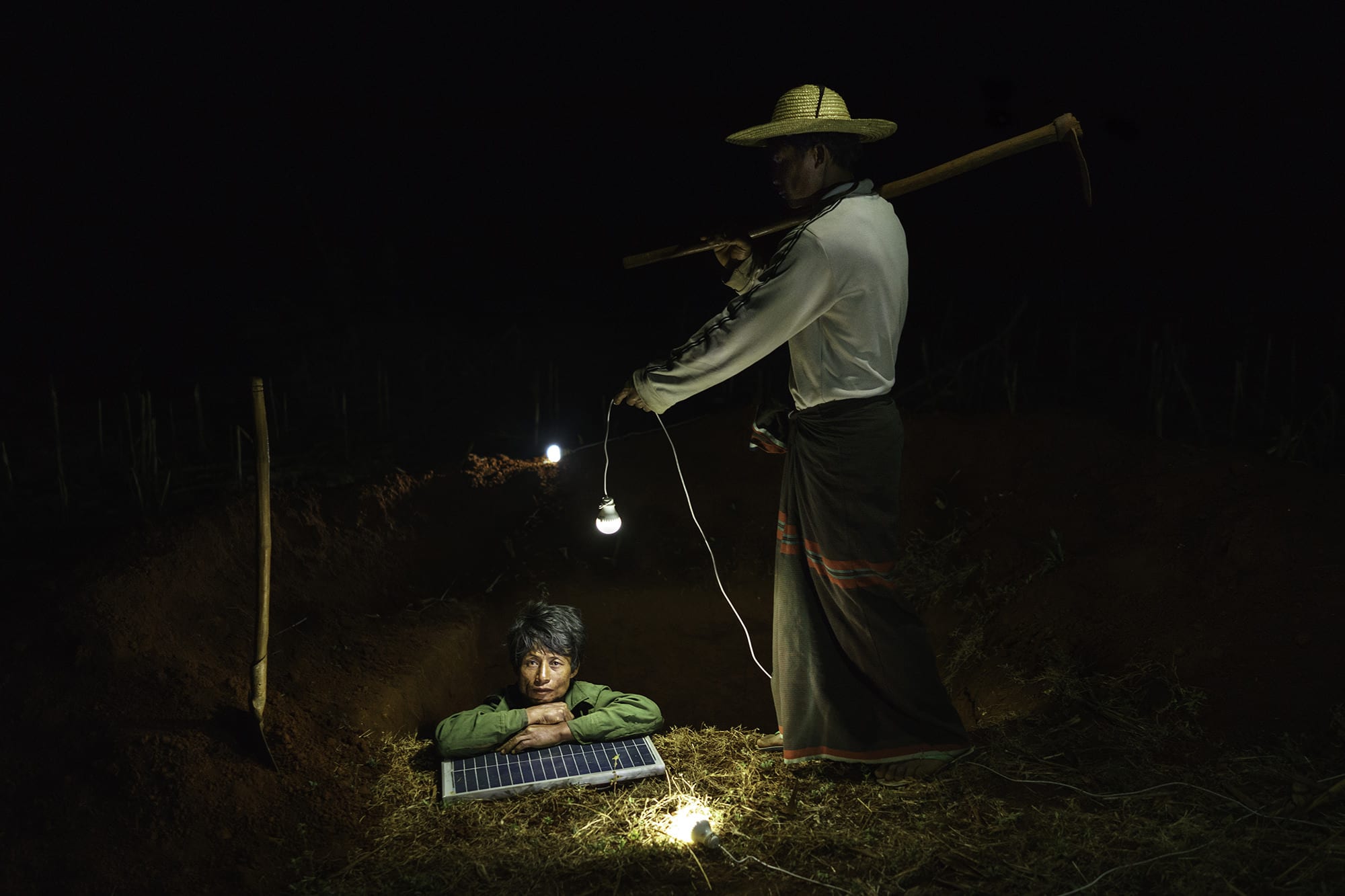 Construction workers dig a household latrine.