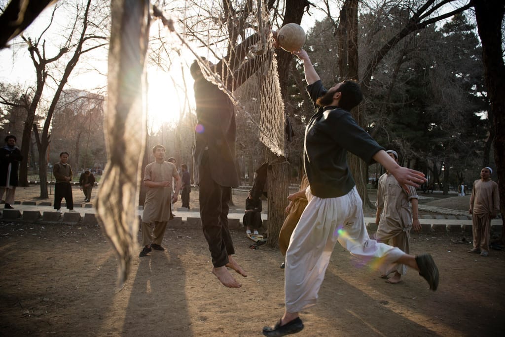 KABUL, AFGHANISTAN | 2015-03-12 | Every Friday the Shahre Now park fills up with hundreds of young afghan men who come to the park to play volleyball, soccer or cricket.