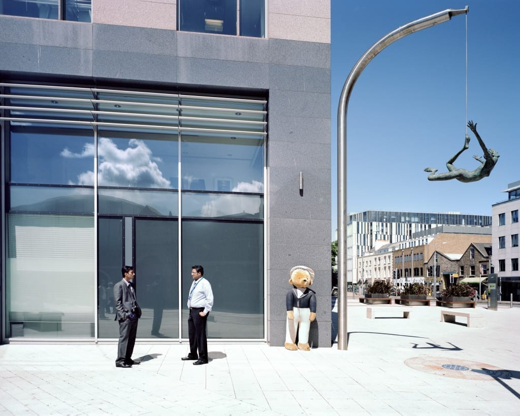 Businessman have a chat in front of Liberation House.