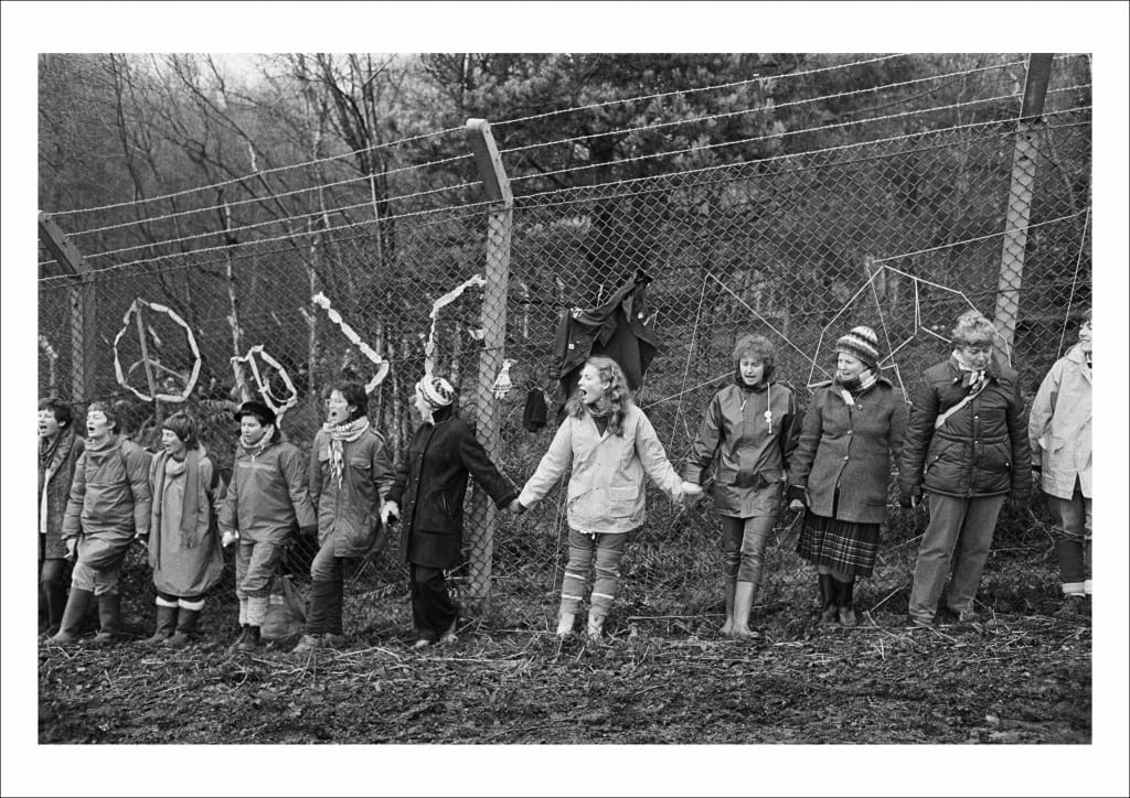 ‘Embrace the Base’: 30,000 women link hands, completely surrounding the nine mile perimeter fence at RAF/USAF Greenham Common, Berkshire (1982)