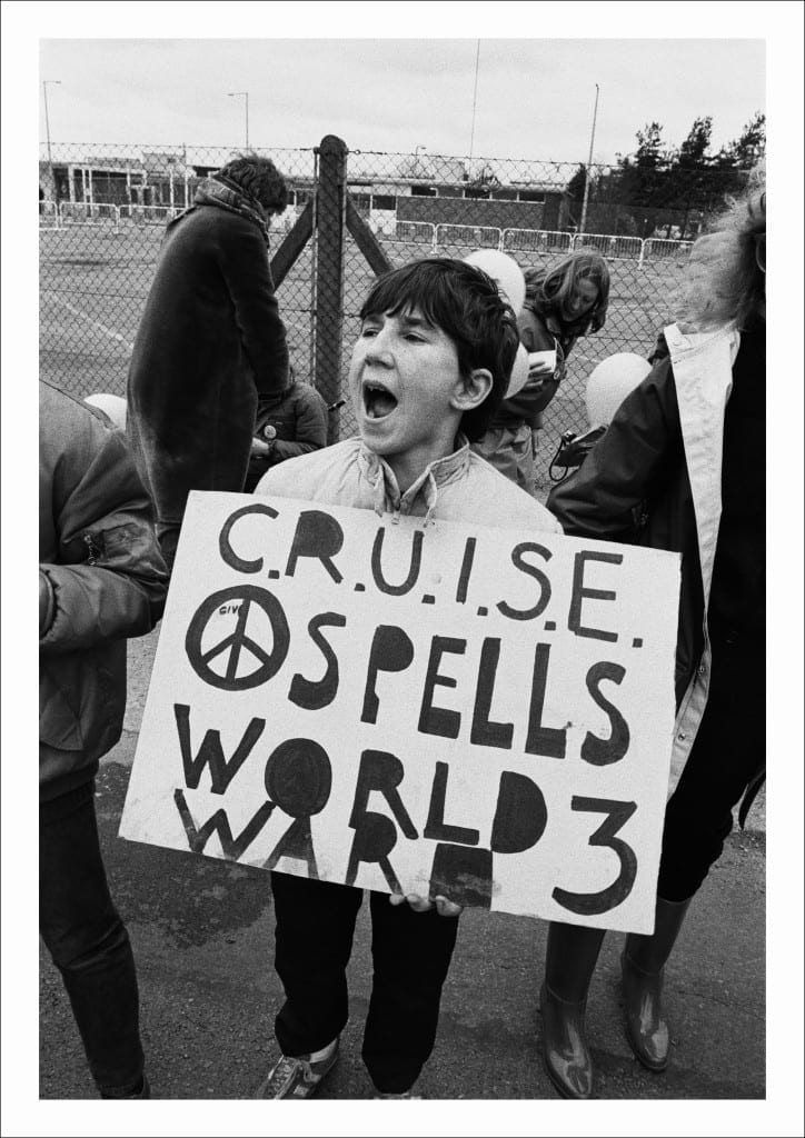 A young protester joins a CND rally after the ‘Peace Chain’ event staged outside the Atomic Weapons Research Establishment, Aldermaston, Berkshire (1983)