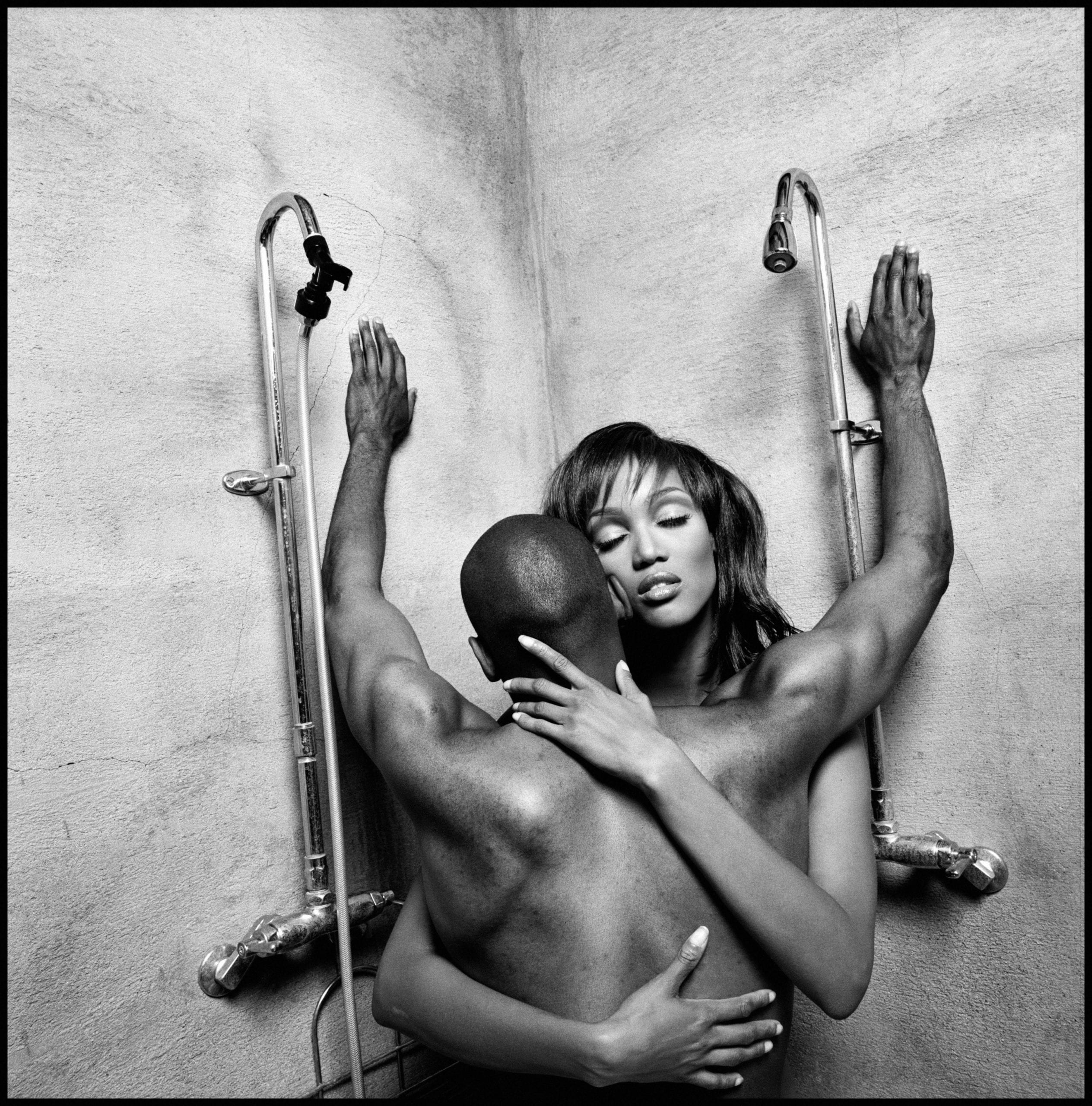 Model and actress Tyra Banks embraces film director John Singleton, 1994.