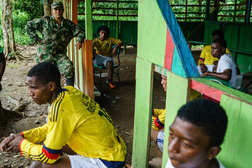 FARC rebels rest during the football match. 3 May 2016. Photo © Federico Rios