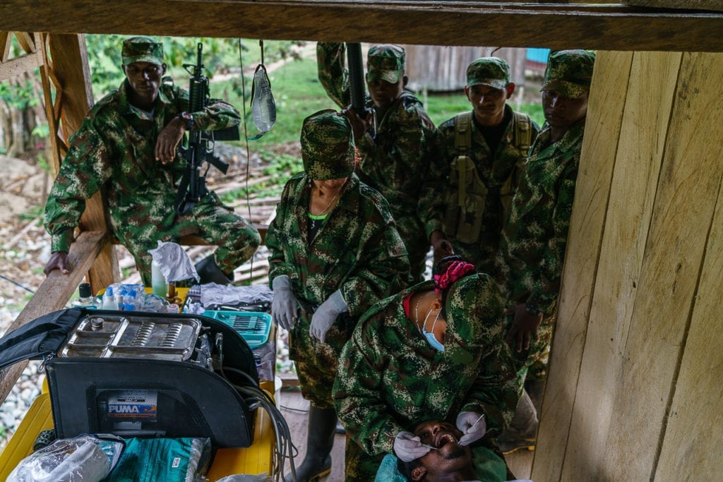 A patient gets treated at the FARC dentist. More or less 400 patients have been treated here in the past three months. Service is free of charge for the population in the area and many travel several days to reach the place. 2 May 2016. Photo © Federico Rios.