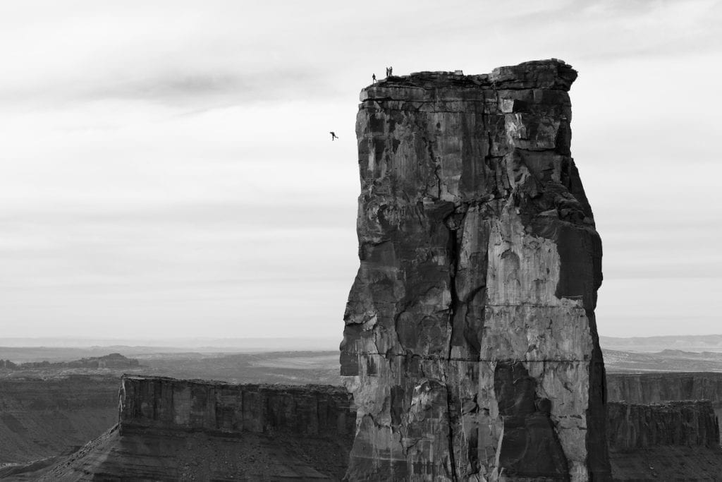 Krystle Wright (Australian, born 1987). Freefall, Michael Tomchek leaps off Castleton Tower (400ft) as fellow BASE jumpers look on, Castle Valley, Utah, 2010, printed 2016. Inkjet print, 13 1/4 x 20 in. (33.9 x 50.8 cm). Collection of Krystle Wright