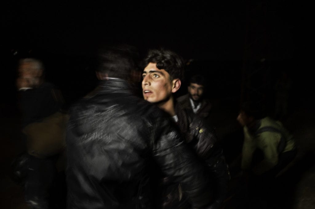 Along the Turkey-Syria border. March, 2012. Syrian refugees arrive inside Turkish territory under the cover of night after being smuggled from in from Syria.