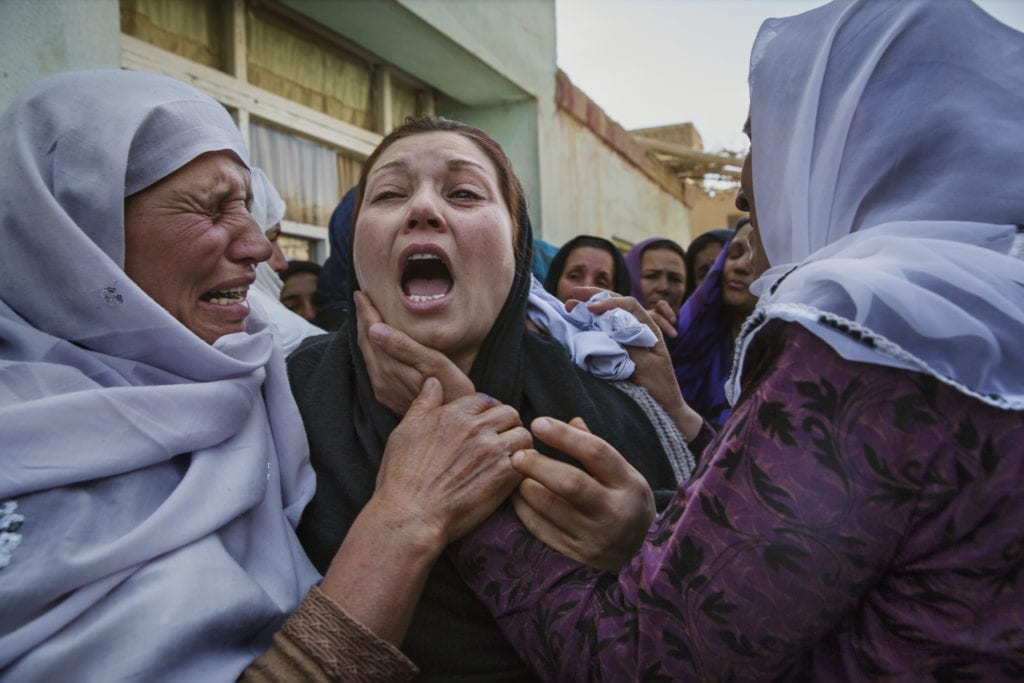 Women's rights activists grieve at the home of Farkhunda Malikzada