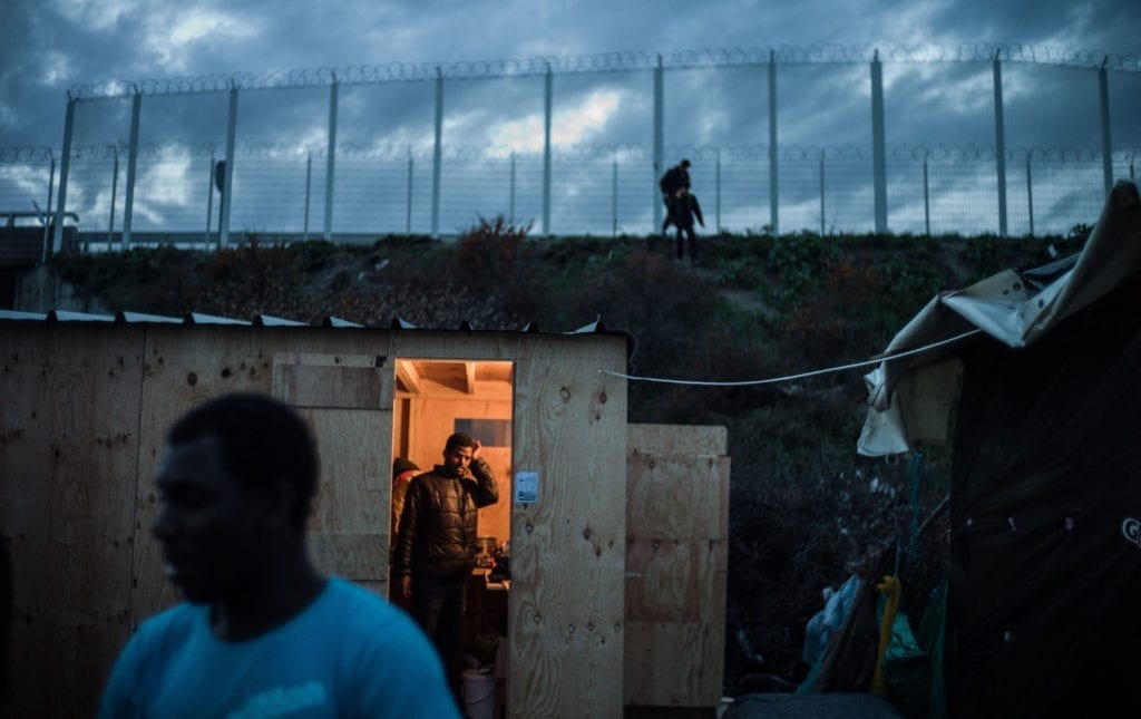 Programme Name: Exodus: Our Journey to Europe - TX: n/a - Episode: n/a (No. 3) - Picture Shows: Cabins in the Calais Jungle. - (C) Gus Palmer / KEO Films - Photographer: Gus Palmer