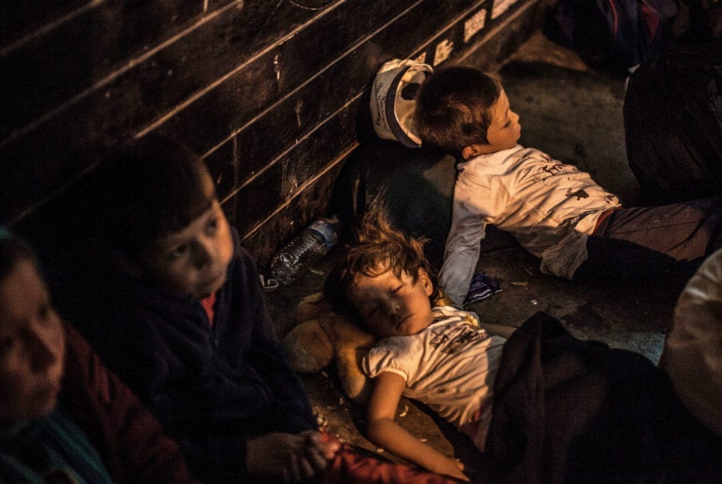 Programme Name: Exodus: Our Journey to Europe - TX: n/a - Episode: n/a (No. 2) - Picture Shows: Afghan Children sleeping in Athens. - (C) Gus Palmer / KEO Films - Photographer: Gus Palmer