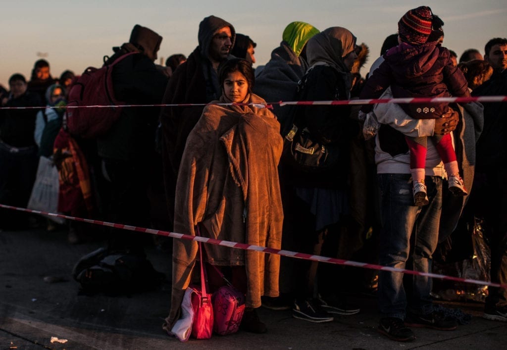 Programme Name: Exodus: Our Journey to Europe - TX: n/a - Episode: n/a (No. 2) - Picture Shows: Refugees waiting to board buses at the Austria/Hungary border. - (C) Gus Palmer / KEO Films - Photographer: Gus Palmer