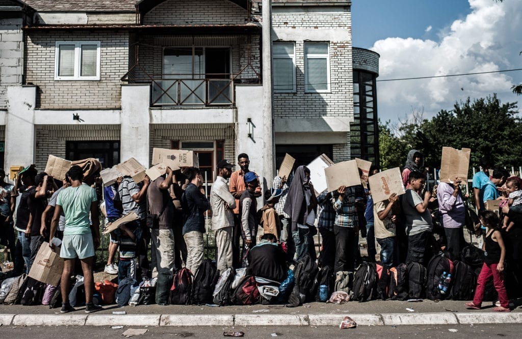 Programme Name: Exodus: Our Journey to Europe - TX: n/a - Episode: n/a (No. 2) - Picture Shows: Refugees arrived from Macedonia waiting for papers to be processed in Presevo Serbia. - (C) Gus Palmer / KEO Films - Photographer: Gus Palmer