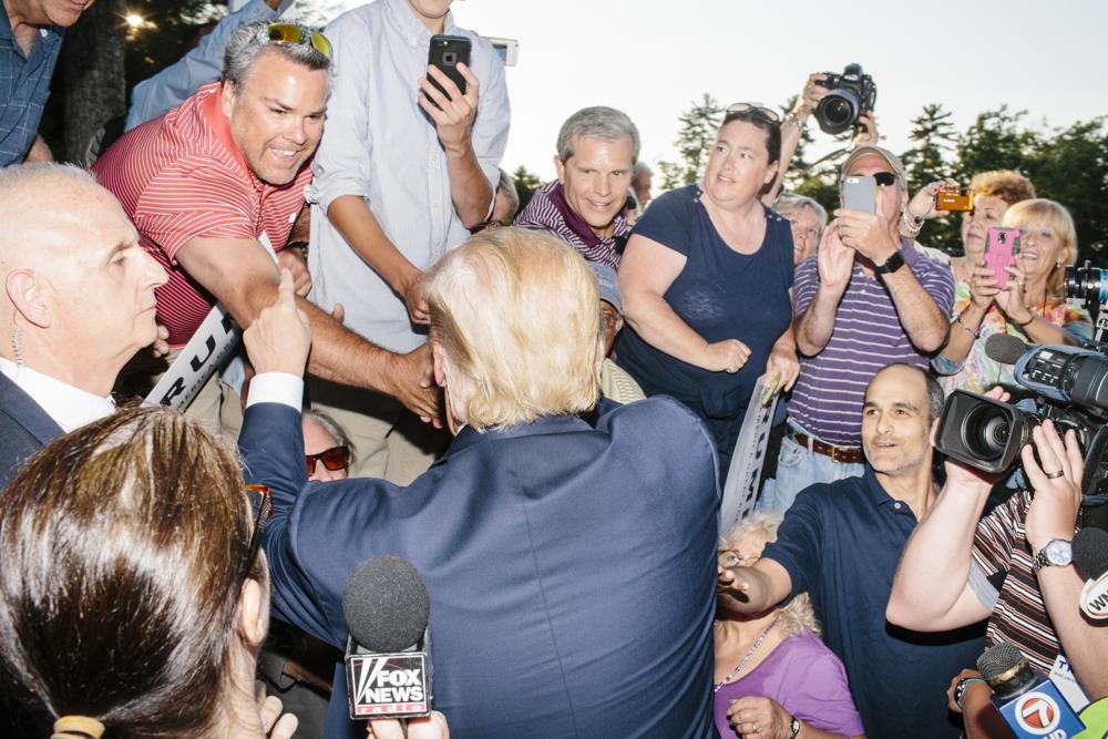Real estate mogul and Republican presidential candidate Donald Trump greets supporters after speaking to supporters at a rally at the Weirs Beach Community Center in Laconia, New Hampshire.