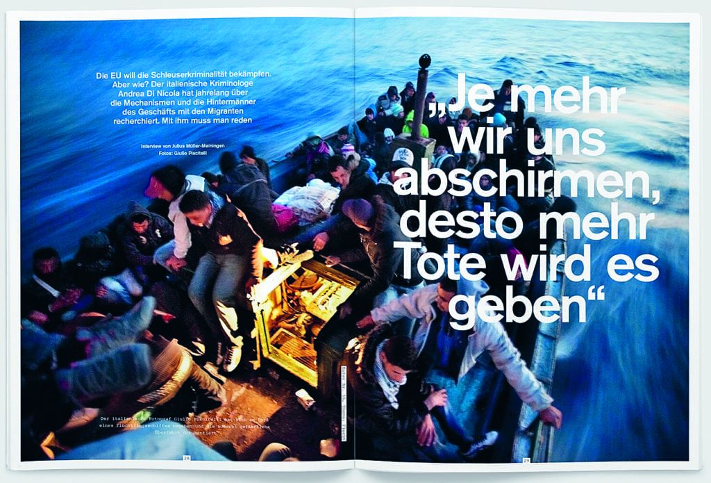 Giulio Piscitelli'a photograph of migrants crossing the Mediterranean in a spread from the 'Flucht' issue.