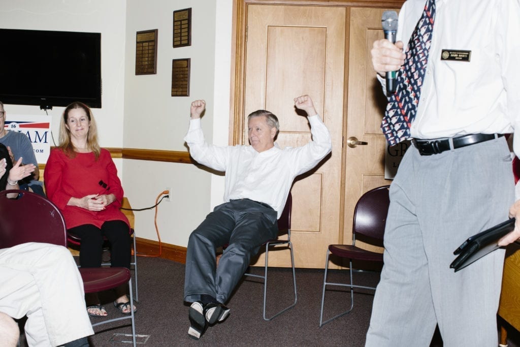 South Carolina Senator and Republican presidential candidate Lindsey Graham jokes with the audience before speaking at a campaign event at the Nesmith Library in Windham, New Hampshire.