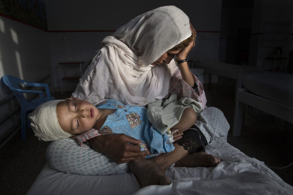 KABUL, AFGHANISTAN -MARCH 29, 2016: A the Emergency hospital Najiba holds her nephew Shabir, age 2, who was injured from a bomb blast which killed his sister in Kabul on March 29, 2016. Najiba had to stay with the children as their mother buried her daughter. In 2016 marked another milestone in its 15-year engagement in Afghanistan. Despite billions of dollars spent by the international community to stabilize the country, Afghanistan has seen little improvement in terms of overall stability and human security. The situation on the ground for Afghans continues to be grave. Security for the Afghan people has also deteriorated in large swaths of the country, further complicating humanitarian response. Afghan civilians are at greater risk today than at any time since Taliban rule. According to UN statistics, in the first half of 2016 at least 1,600 people had died, and more than 3,500 people were injured, a 4 per cent increase in overall civilian causalities compared to the same period last year. The upsurge in violence has had devastating consequences for civilians, with suicide bombings and targeted attacks by the Taliban and other insurgents causing 70 percent of all civilian casualties.