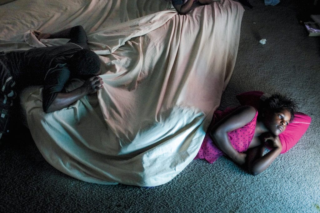 After dinner at Lyniece’s house. Detroit, Michigan. 2012 © Peter van Agtmael/Magnum Photos. From the book Buzzing at the Sill 