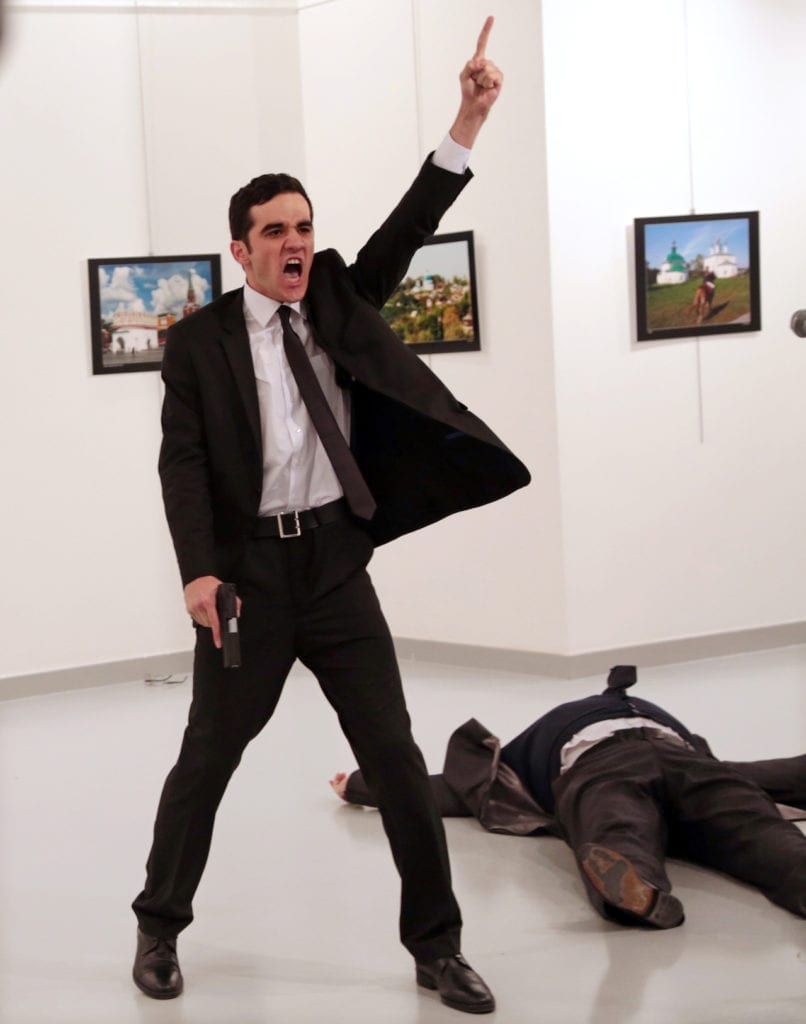 Mevlut Mert Altintas shouts after shooting Andrei Karlov, right, the Russian ambassador to Turkey, at an art gallery in Ankara, Turkey, Monday, Dec. 19, 2016. Image © 