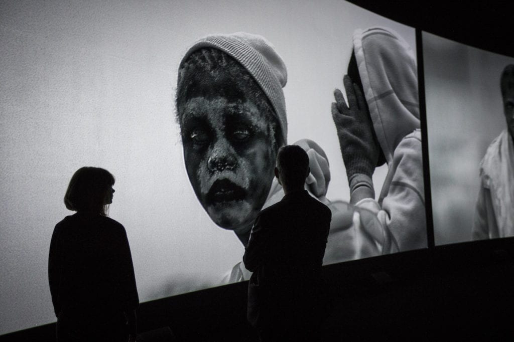 Installation shot of Incoming by Richard Mosse in collaboration with Trevor Tweeten and Ben Frost at The Curve, Barbican. Image © Tristan Fewings/Getty Images for Barbican Art Gallery