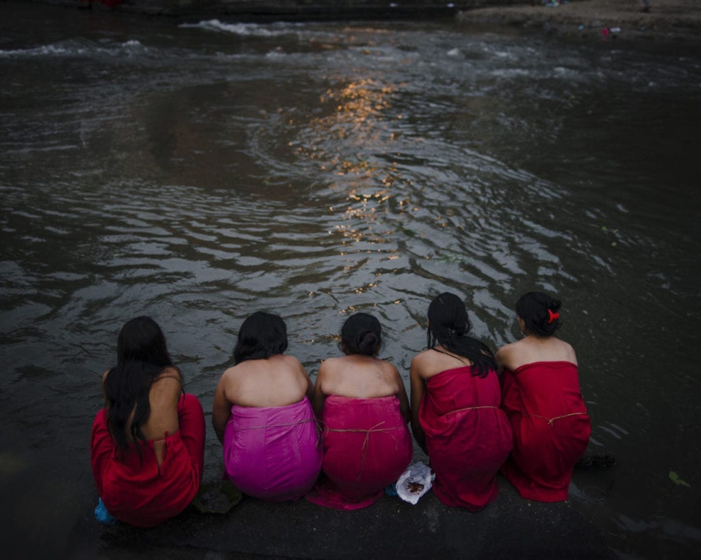 Women observing the ritual to wash away the sins committed during mentruation at the annual Rishi Panchami festival, Kathmandu. Nepal.