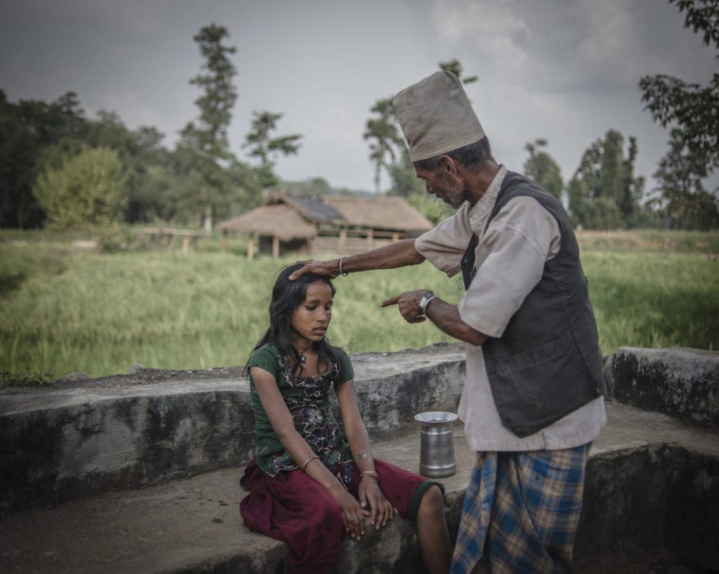 Devi Ram Dhamala, traditional healer, 59. Traditional healers often use extreme verbal and physical abuse to heal young girls who are ill during menstruation or even otherwise, believing they are possessed by evil spirit. Surkhet district, Nepal