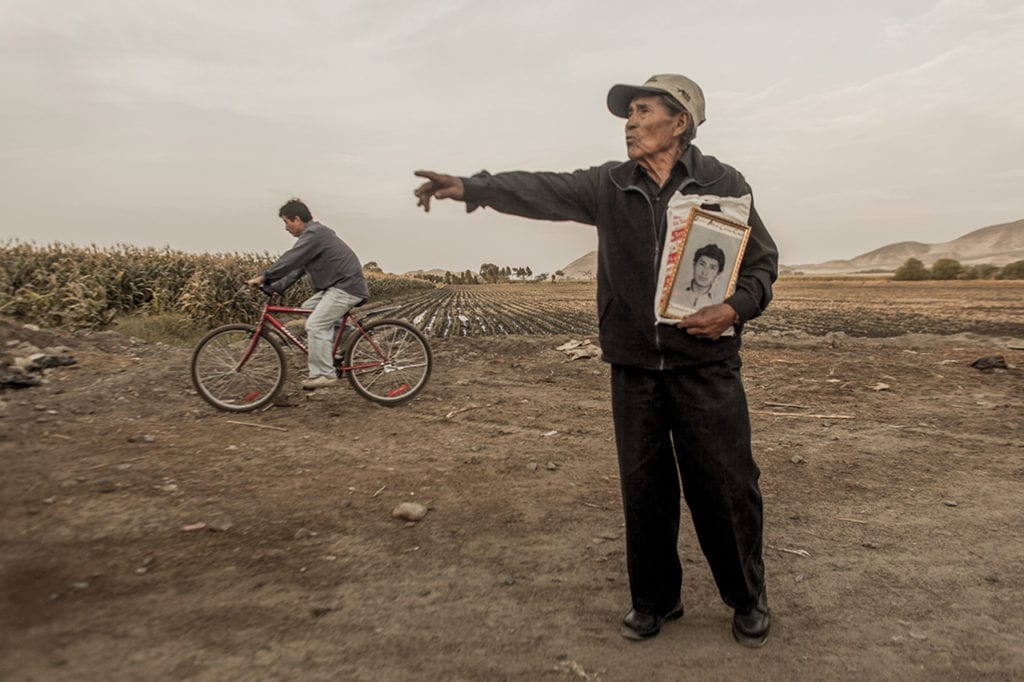 Alejandro Castillo hold a picture of his son Denis; who was missing for more than 20 years; after being kidnaped by a paramilitar group.Early in the morning of May 2; 1992; the paramilitary group 'Colina' kidnapped 9 peasants from the Santa district. After being missing almost 20 years; the remains were found and delivered to their families. This was one the most resounding cases during the dictatorship of Alberto Fujimori; now in jail for human rights violations. ©Musuk Nolte / Native Agency