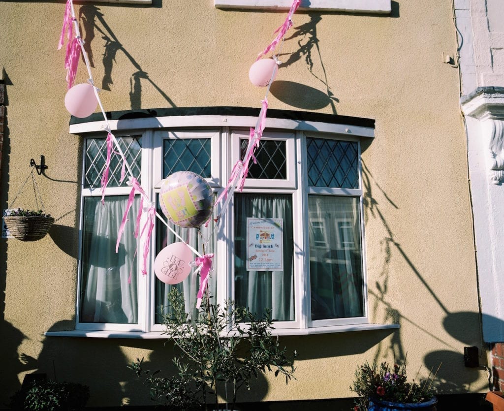 Decorations outside a home in Bristol, to celebrate the arrival of a new baby girl. From the series My Favourite Colour Was Yellow © Kirsty MacKay