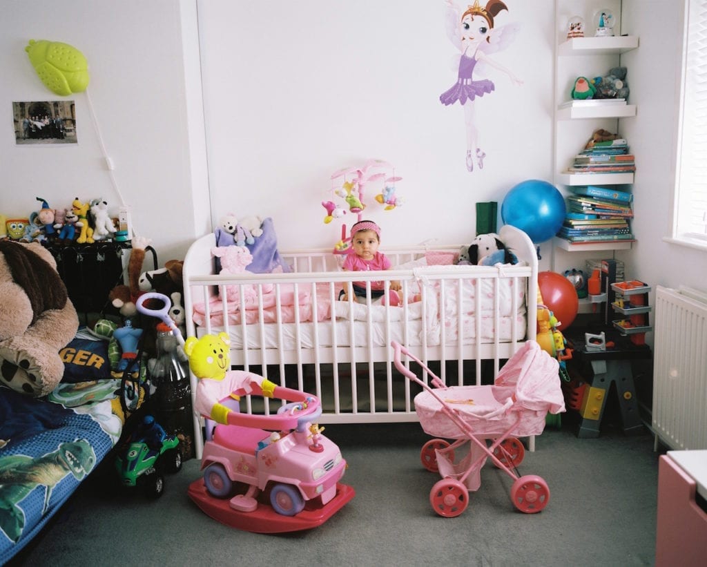 Yasmine in her bedroom she shares with her older brother. From the series My Favourite Colour Was Yellow © Kirsty MacKay