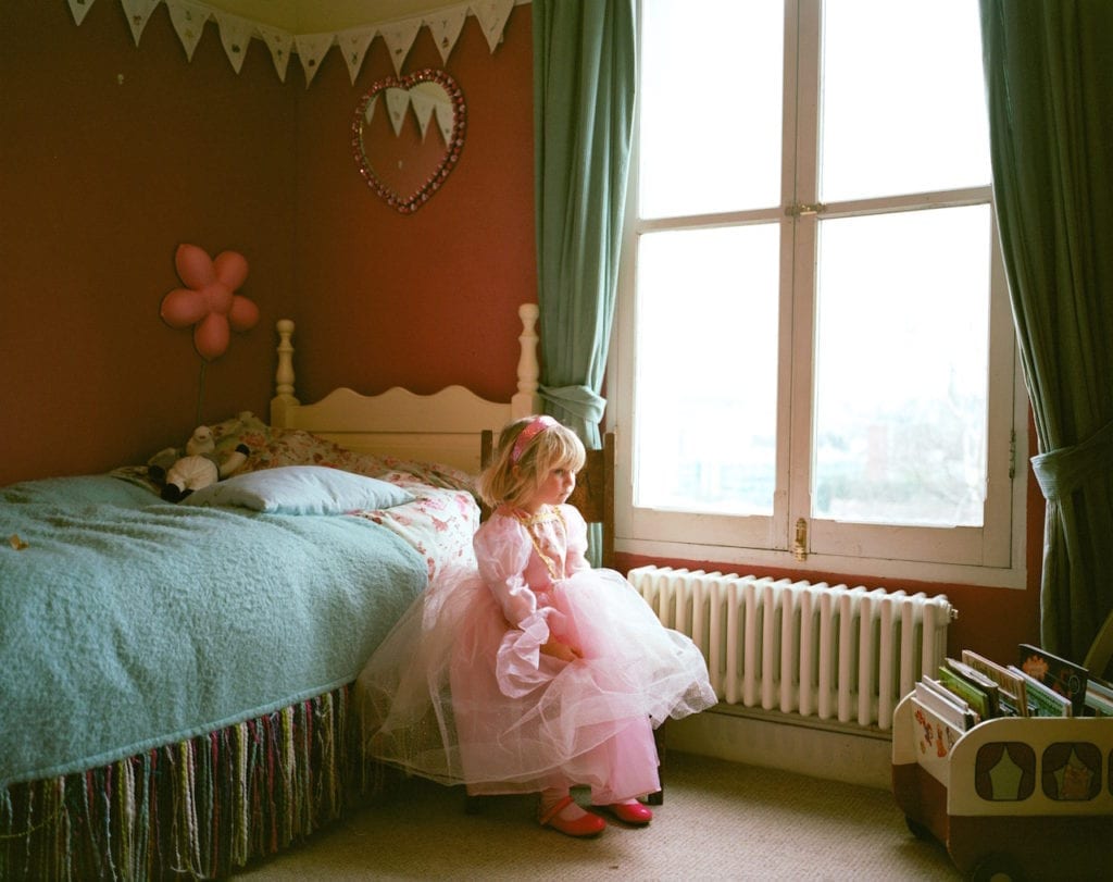 Charlie, dressed up as a princess, at her friend's house. From the series My Favourite Colour Was Yellow © Kirsty MacKay