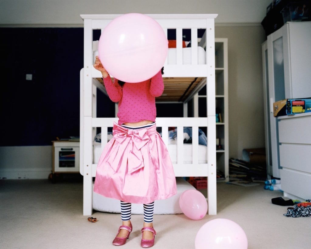 Mabel playing in her bedroom, Bristol, UK. From the series My Favourite Colour Was Yellow © Kirsty MacKay 