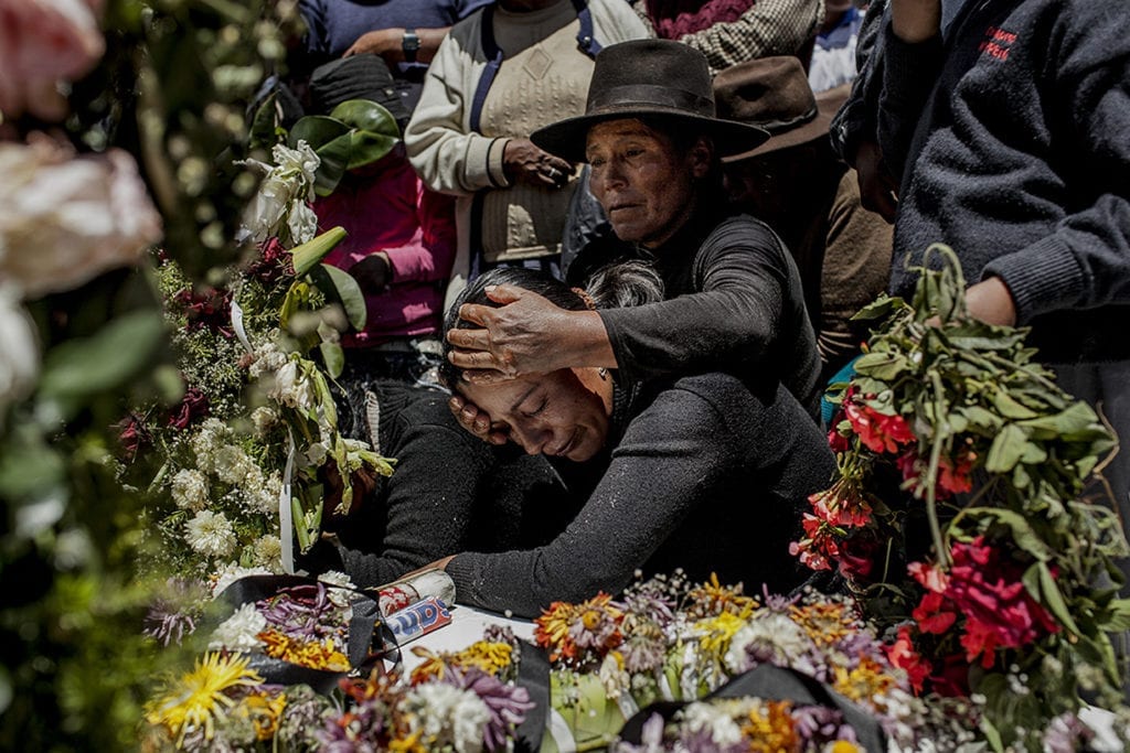 Relatives of the 11 exhumated bodies; during the burial in the local cementery of Soras.On July 16; 1984; a bus from the 'Cabanino' company was doing the usual route towards Soras. In the vehicle were 40 members of the terrorist group Sendero Luminoso. The bus stopped in the towns of Chaupishuasi; Doce Corral and Soras; murdering over one hundred people who refused to join their ranks. Over 27 years later; the remains of 14 of these people can finally rest in peace in the Soras local cemetery. © Musuk Nolte / Magnum Foundation