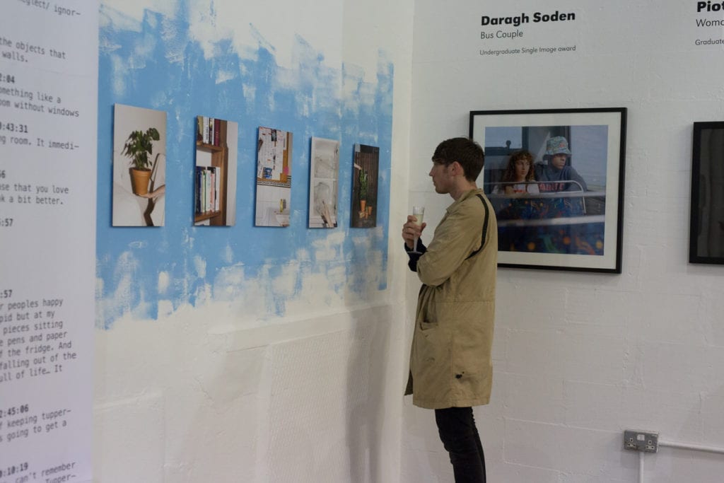 A visitor to the 2016 Breakthrough Awards exhibition admires Jan McCullough's installation. Image © BJP