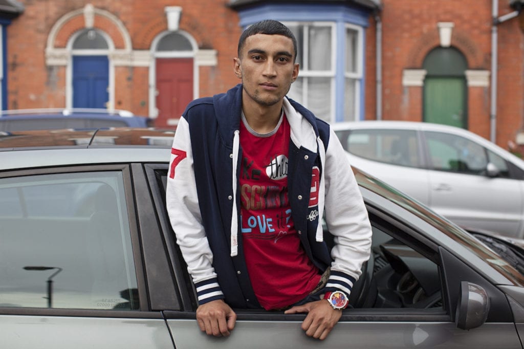 Red T-Shirt, baseball jacket, car, from the series You Get Me?, 2009 © Mahtab Hussain, courtesy the artist