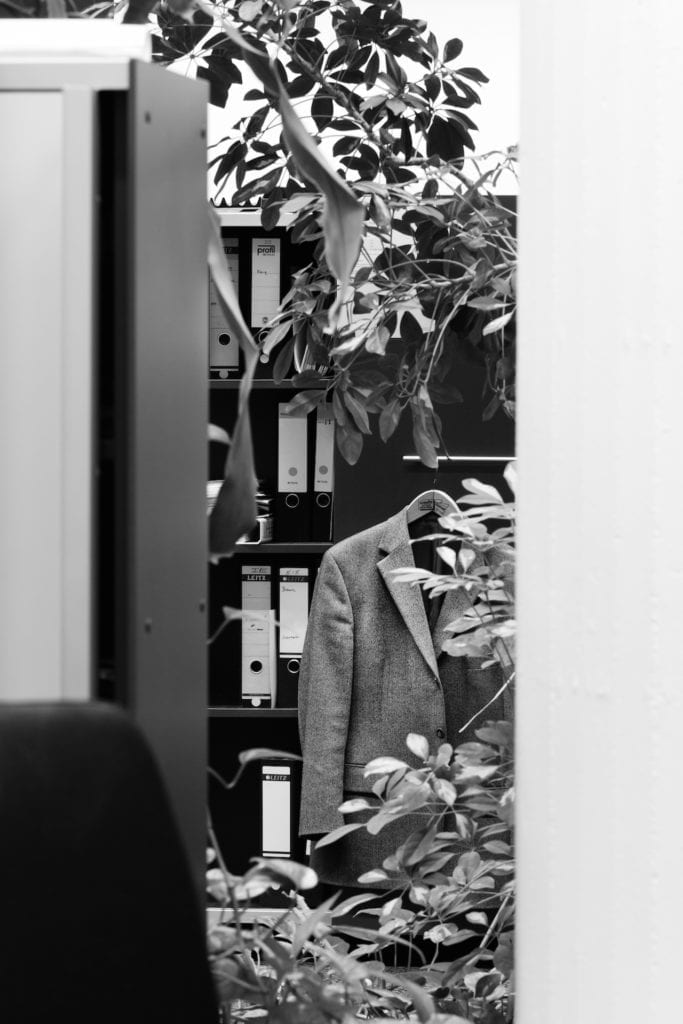 Overgrown suit jacket and filing cabinet, open space office, private bank, Stuttgart. From the series Büropflanze , 2012 © Saskia Groneberg, courtesy Prix Pictet