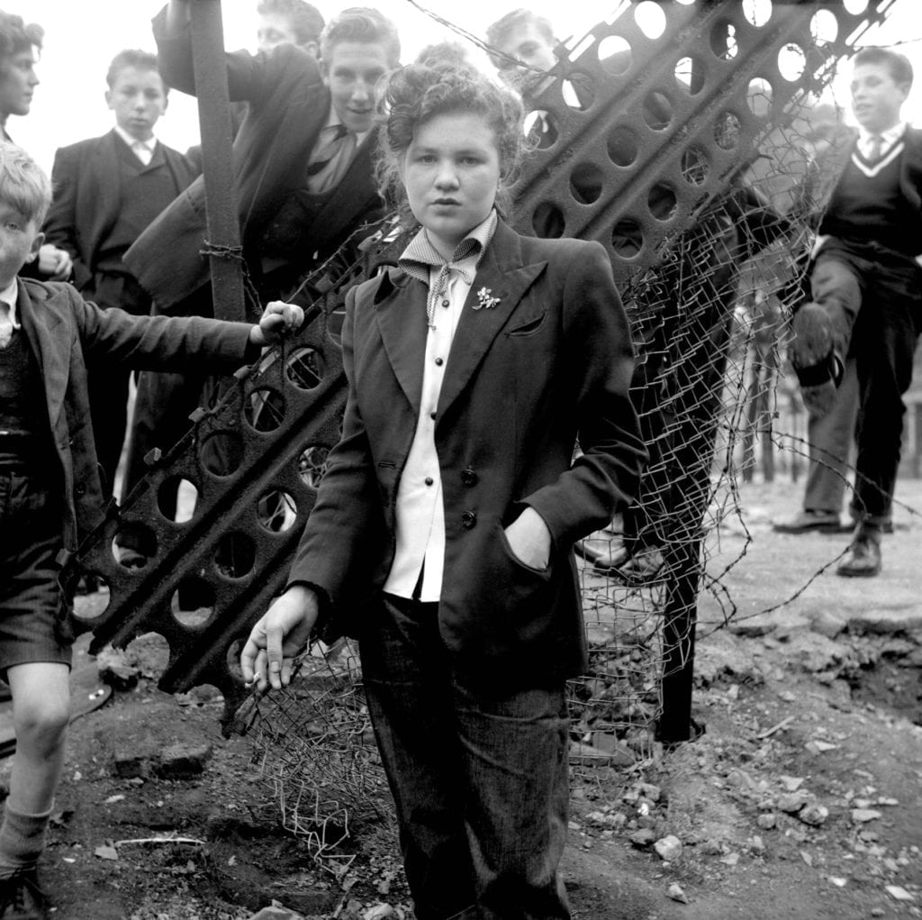 In Your Dreams, January 1955, from the series The Last of the Teddy Girls and showing the then-14-year-old Jean Rayner in London © Ken Russell. 14 year old Jean Rayner in the exploratory stage of Teddyism. Update: Ted Bunton is the boy behind her head, left of centre, identified by him in January 2017 (and Topfoto presented with a print). Jean Rayner died some time previously.