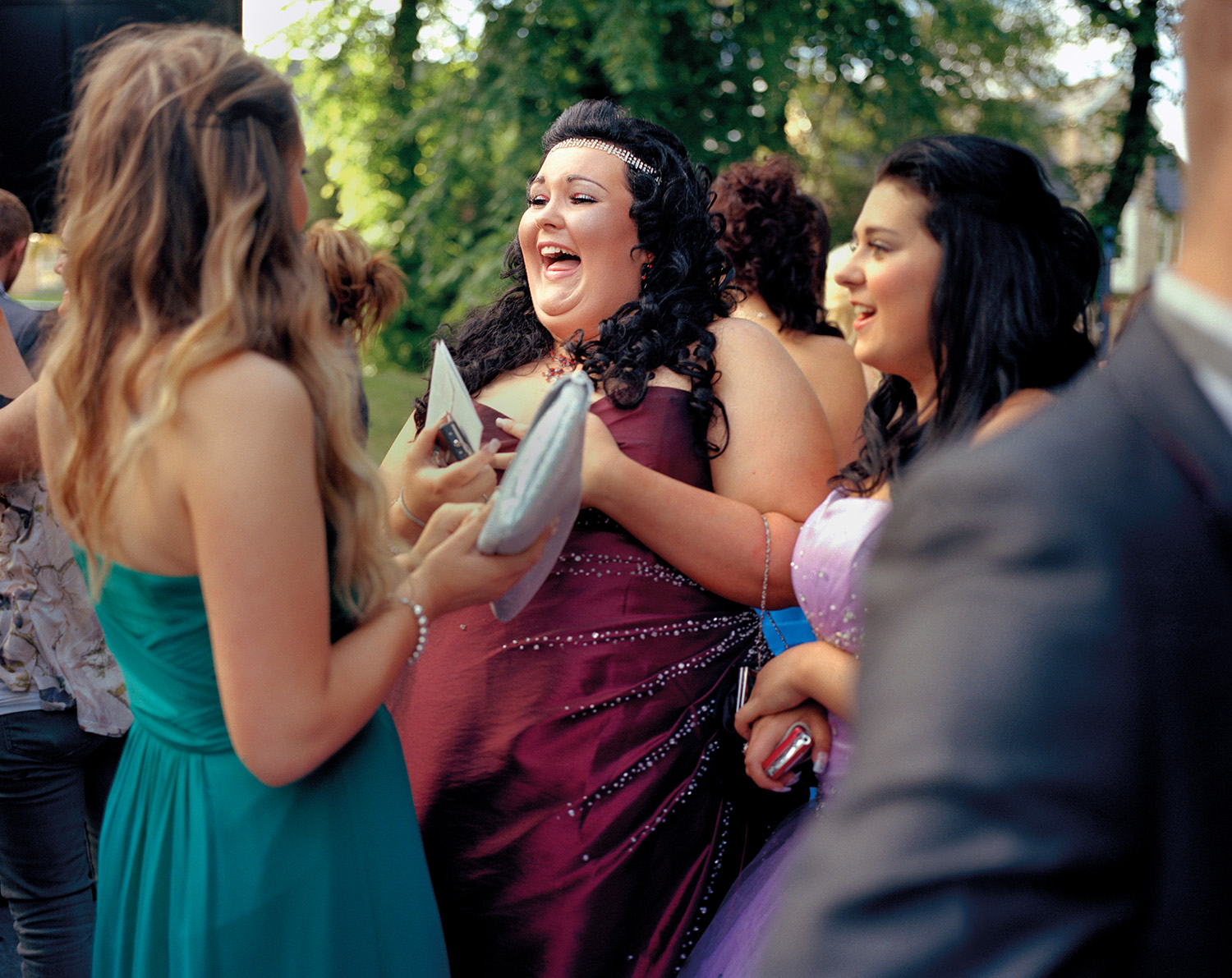 Shannon, age 15, laughing with friends at prom. Sheffield, 2012