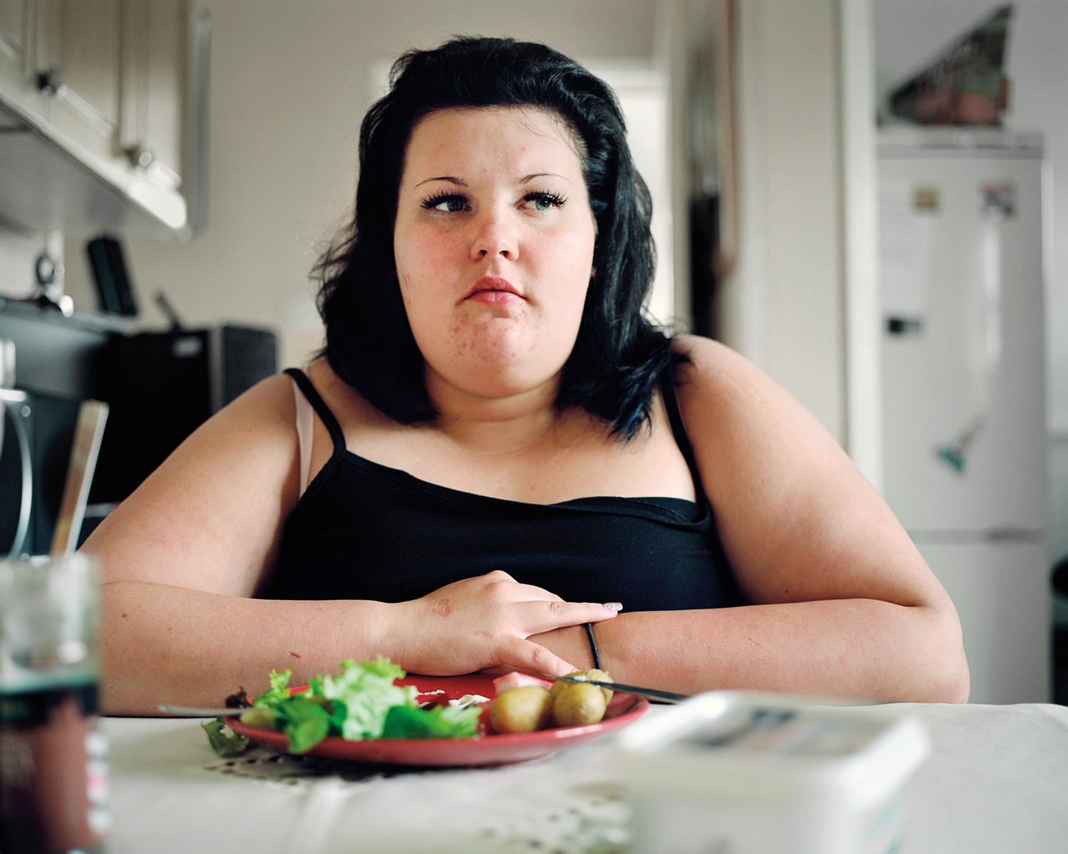 Shannon, age 15, watching her food intake at home. Sheffield, 2012