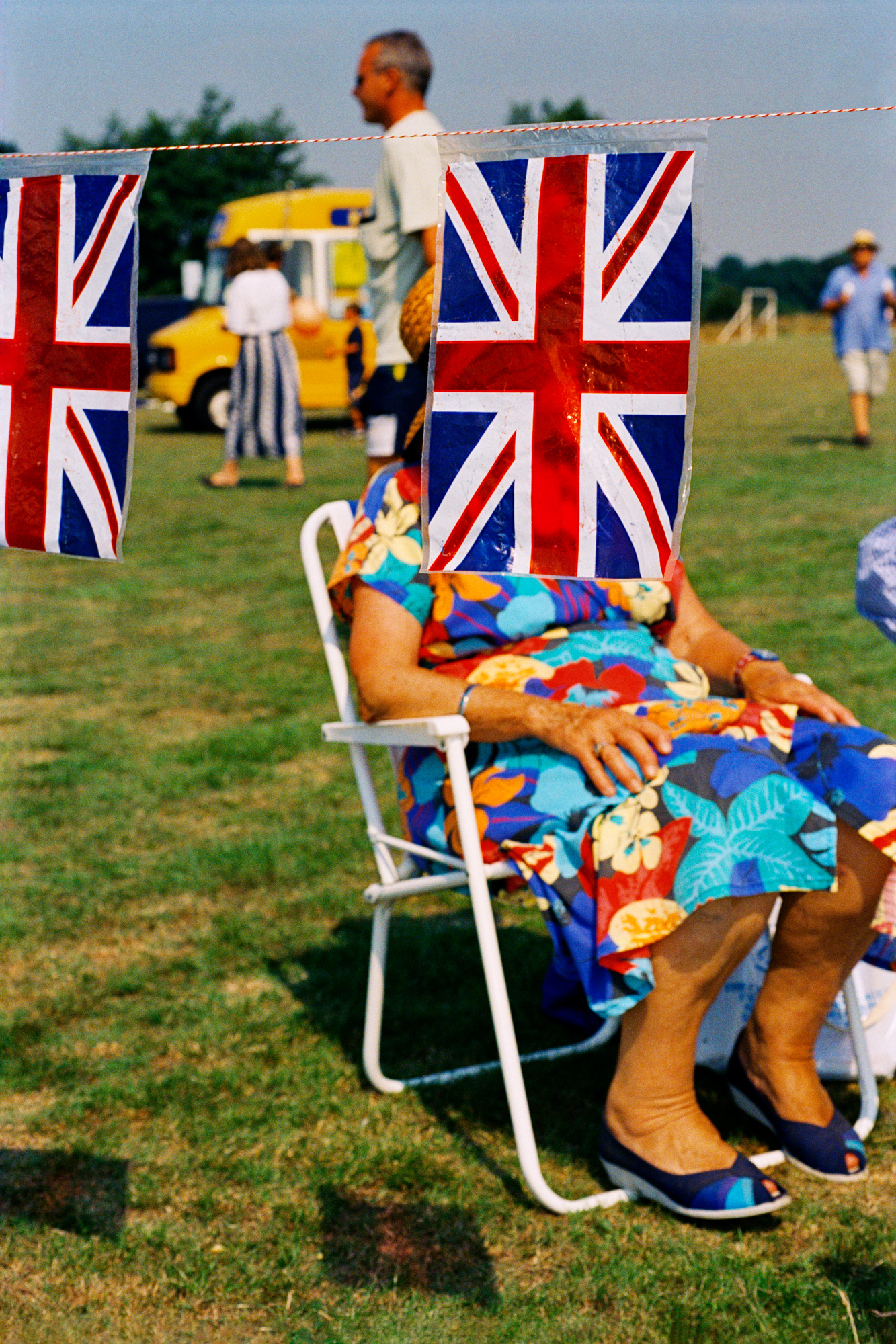 GB. England. Sedlescombe. British flags at a fair. 1995-1999.