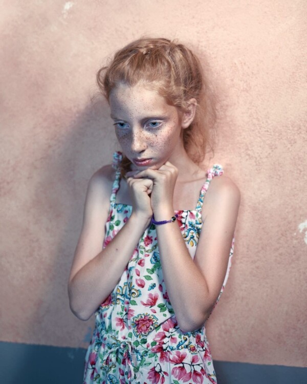 Girl outside the pizzeria at night