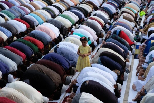 Girl in the Middle of Praying Men, Lisbon, Portugal