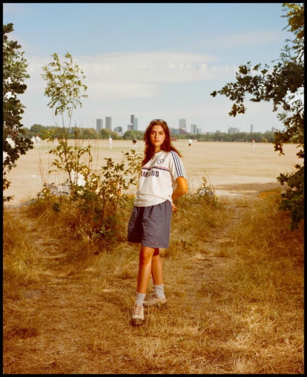 Carla walking through Hackney Marshes in her Chelsea top.